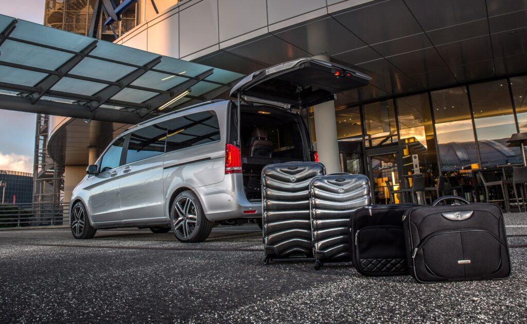 Airport transfer in luxury fleet with classic city