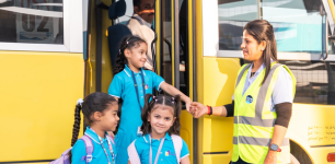 School bus in dubai with classic city tourism