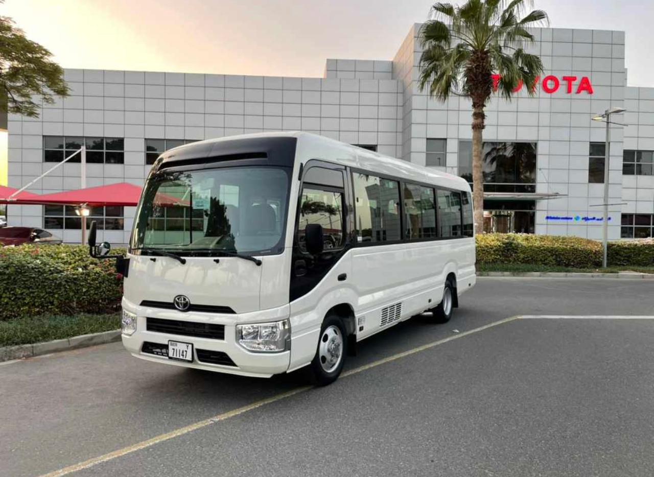 23 Seater Toyota Coaster for front side view